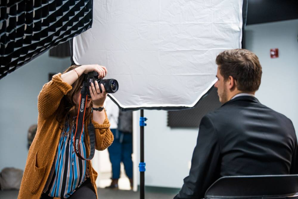 A photographer takes a headshot at a Career Bootcamp